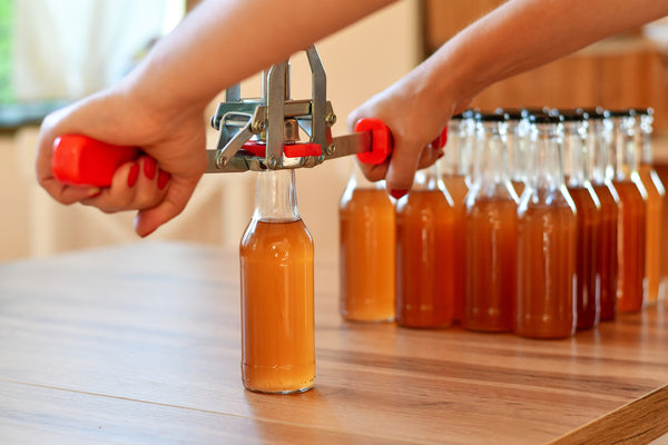 "Crafting Excellence: The Art of Home Brewing with Glass Bottles and Crowns in the UK"